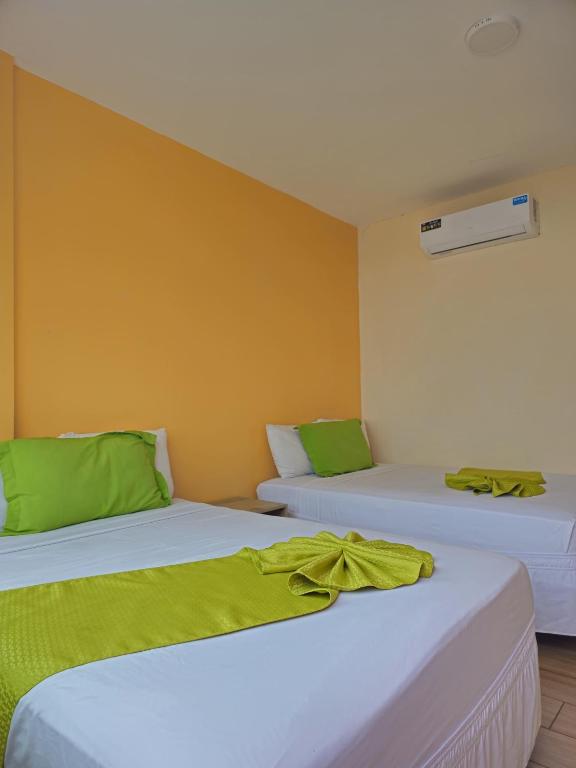 Postel nebo postele na pokoji v ubytování Coco Beach
