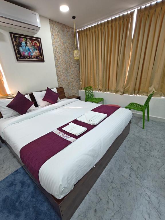 Postel nebo postele na pokoji v ubytování Hotel First Class