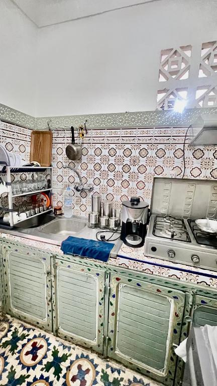 A kitchen or kitchenette at Riad Dar Lokman