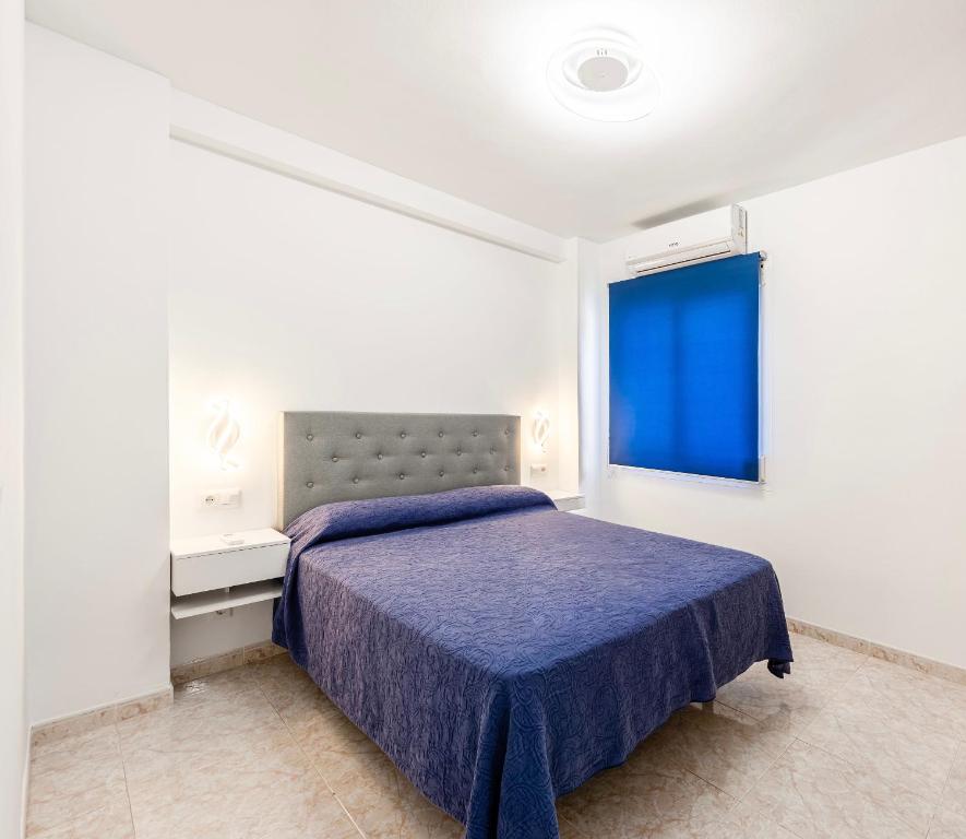 Ένα ή περισσότερα κρεβάτια σε δωμάτιο στο EDIFICIO CHAPARIL