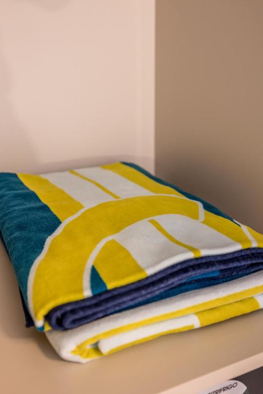 a pile of towels sitting on top of a table at Guesthouse Rooms Split in Split