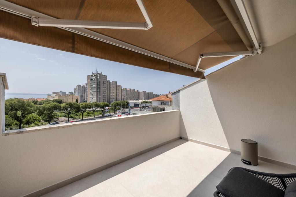 a balcony with a view of a city at Guesthouse Rooms Split in Split