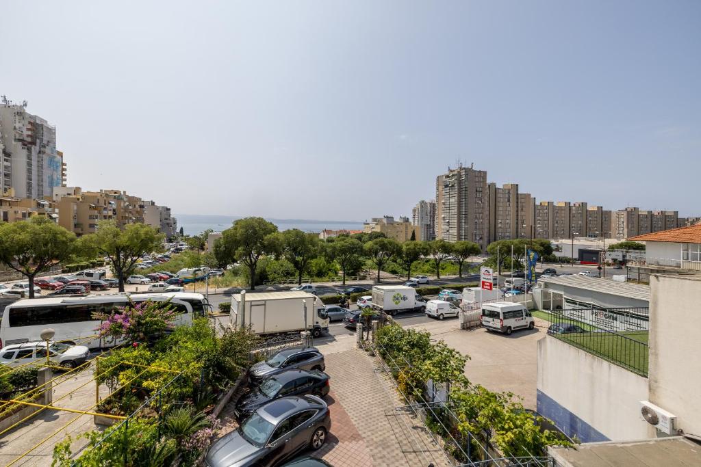 a parking lot with parked cars in a city at Guesthouse Rooms Split in Split