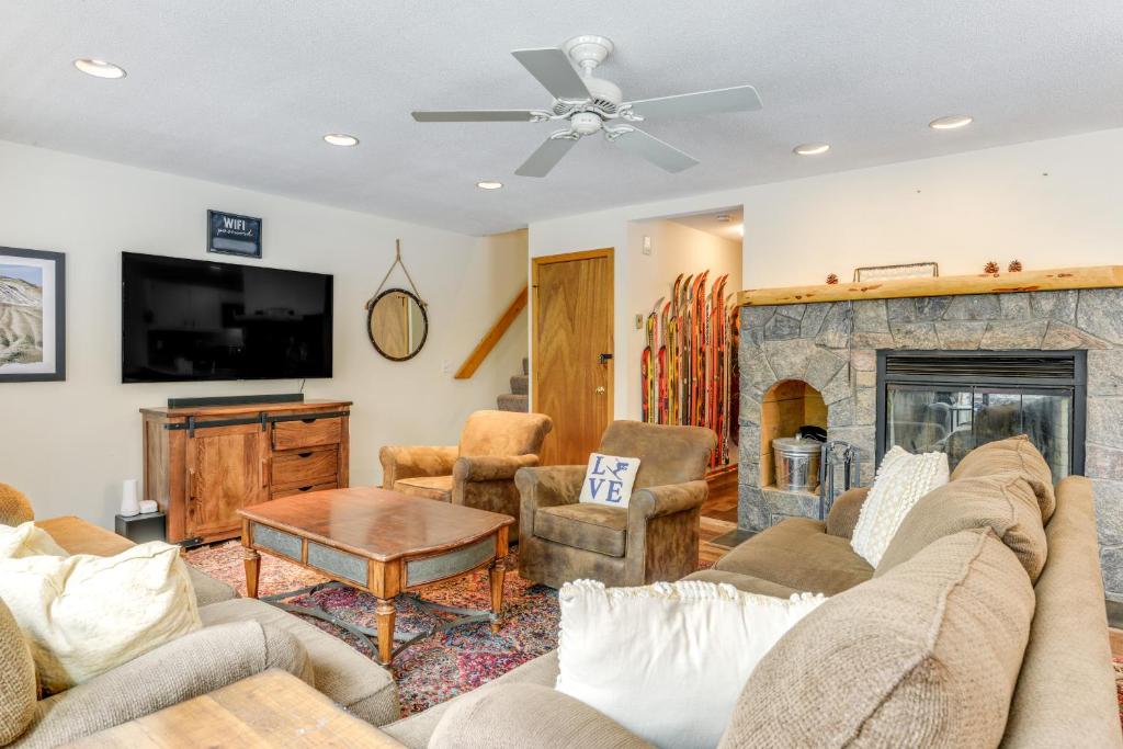 a living room with a couch and a fireplace at 3 min to Mt Snow with FREE Shuttle! Family-Size fun, Wood fireplace, 2 living rooms, Arcades in Dover