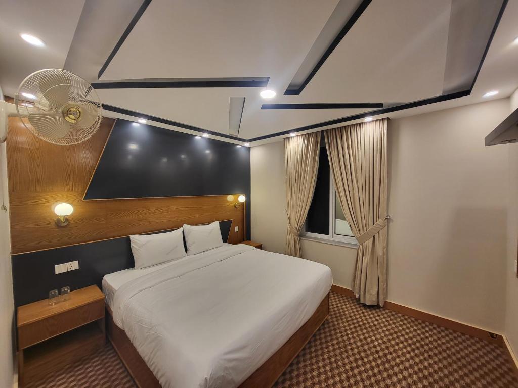 Ένα ή περισσότερα κρεβάτια σε δωμάτιο στο Dolphin Lodge