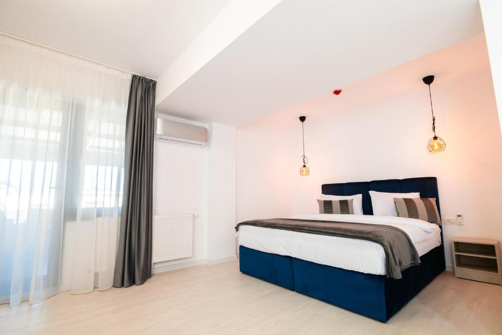 Postel nebo postele na pokoji v ubytování Hotel-Apartments Roxy&Maryo
