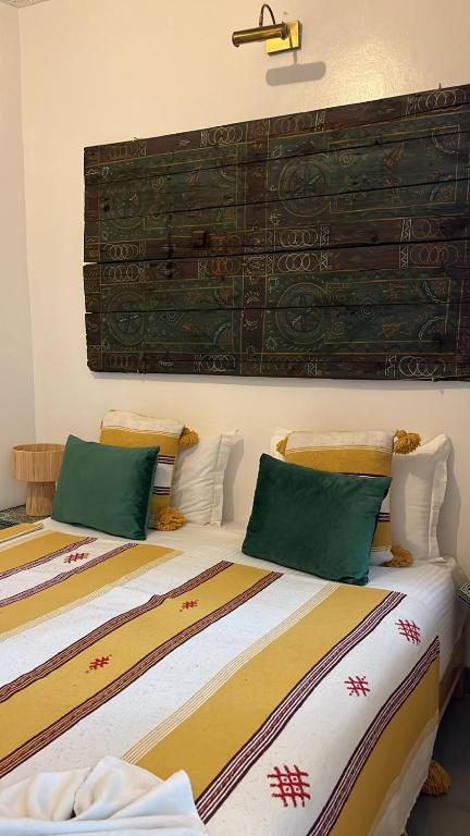 Postel nebo postele na pokoji v ubytování Riad EL BADI