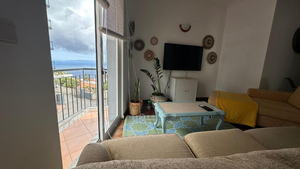 Μια τηλεόραση ή/και κέντρο ψυχαγωγίας στο Apartment Blue Haven