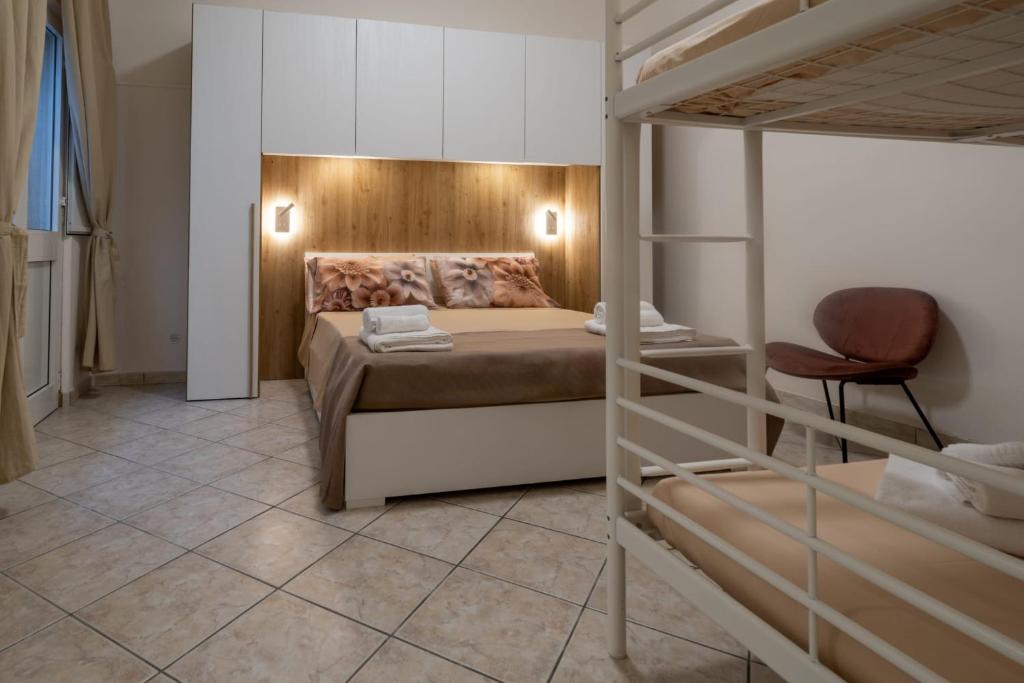 a bedroom with a bed and a bunk bed at Frontemare in Porto Cesareo