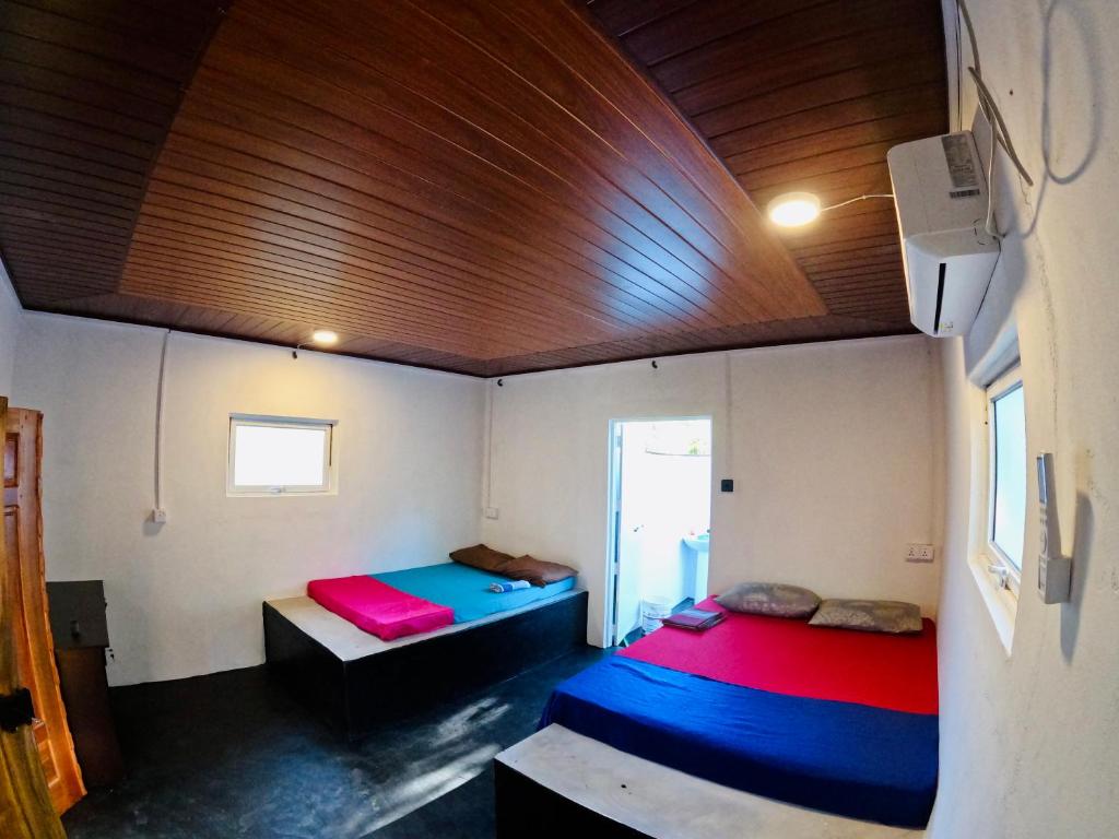 Postel nebo postele na pokoji v ubytování Delft Village Stay