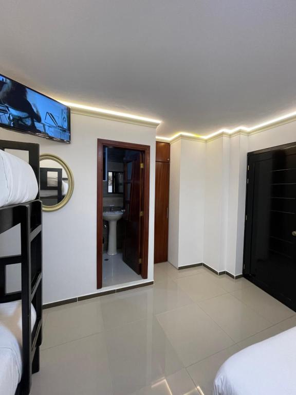 Postel nebo postele na pokoji v ubytování Hostal Balcon del Cielo