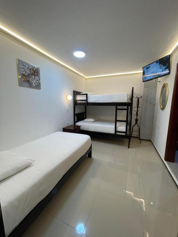 Postel nebo postele na pokoji v ubytování Hostal Balcon del Cielo