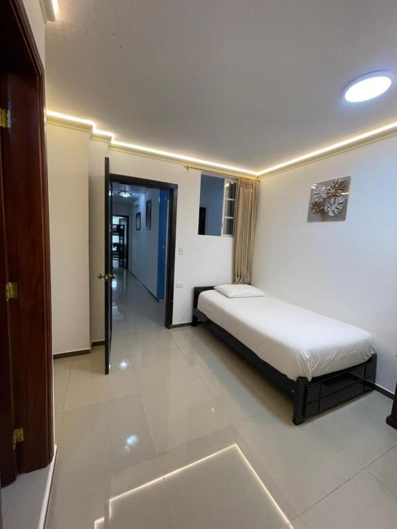 Postel nebo postele na pokoji v ubytování Hostal Balcon del Cielo