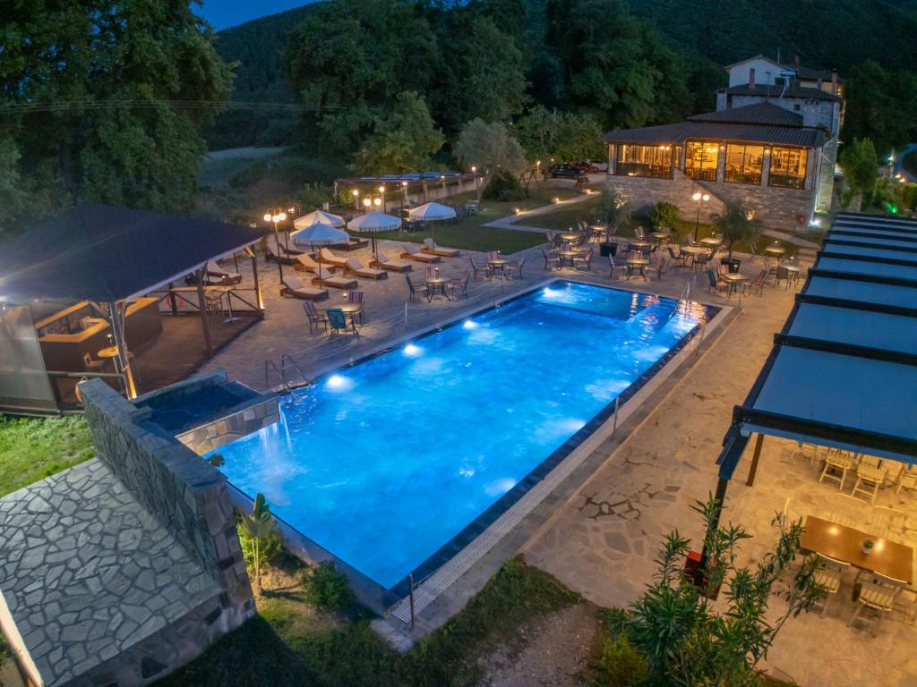 an overhead view of a swimming pool at night at Archontiko Liamas in Stavros