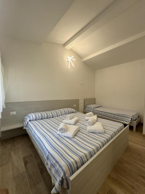 Postel nebo postele na pokoji v ubytování Harmonia Village