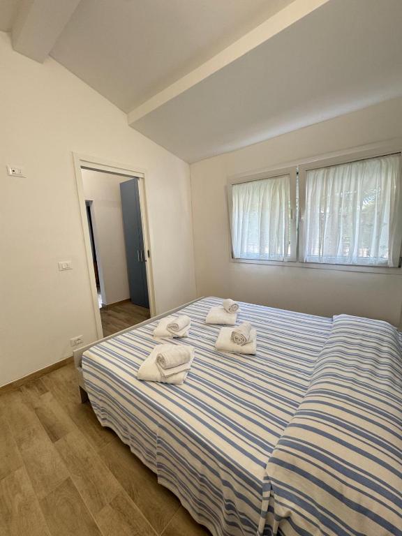 Postel nebo postele na pokoji v ubytování Harmonia Village