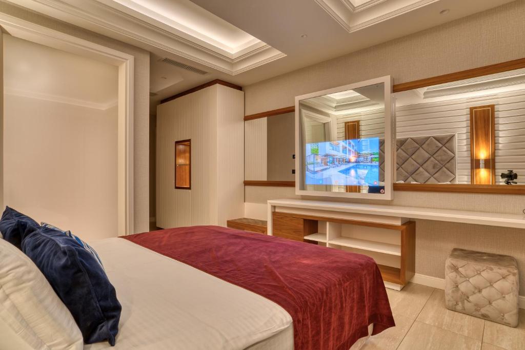 Postel nebo postele na pokoji v ubytování Boutique Hotel R Palazzo
