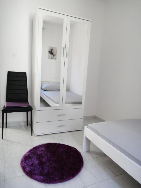 Posteľ alebo postele v izbe v ubytovaní Apartments Blu Mare