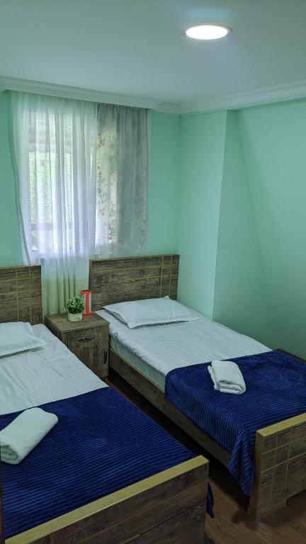 Postel nebo postele na pokoji v ubytování MATE Private Bathrooms