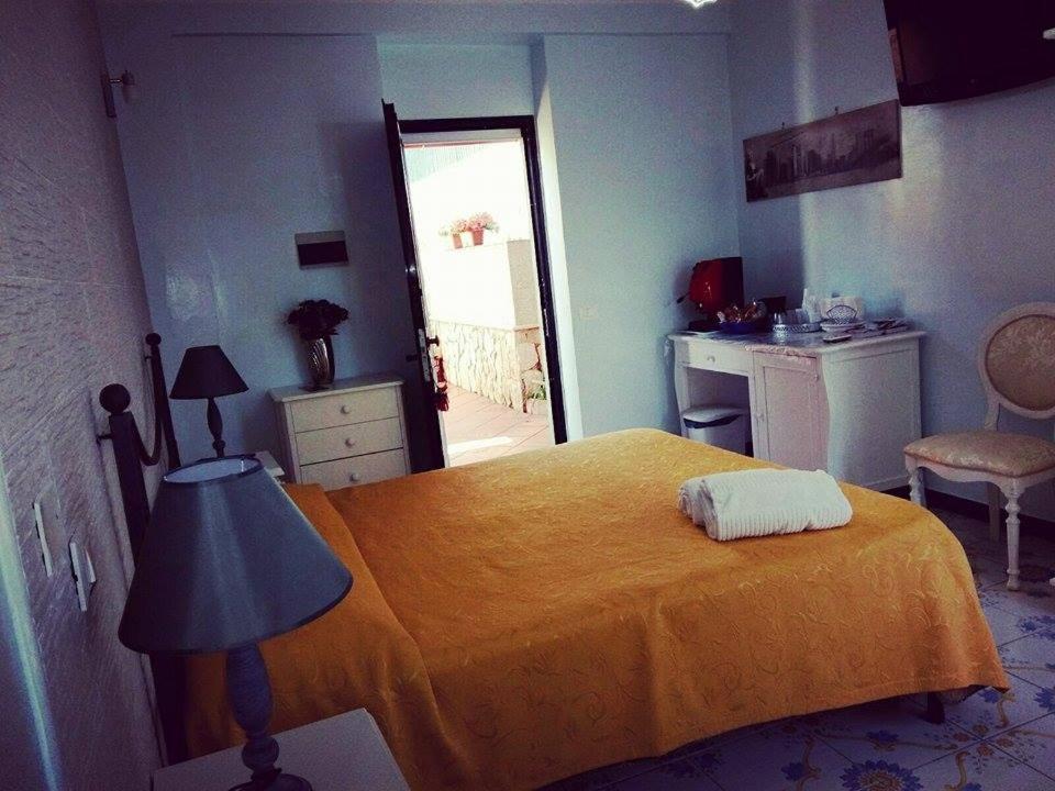 Postel nebo postele na pokoji v ubytování B&B Appartamenti l'Anfora