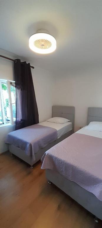 Postel nebo postele na pokoji v ubytování Apartments Anka Pag