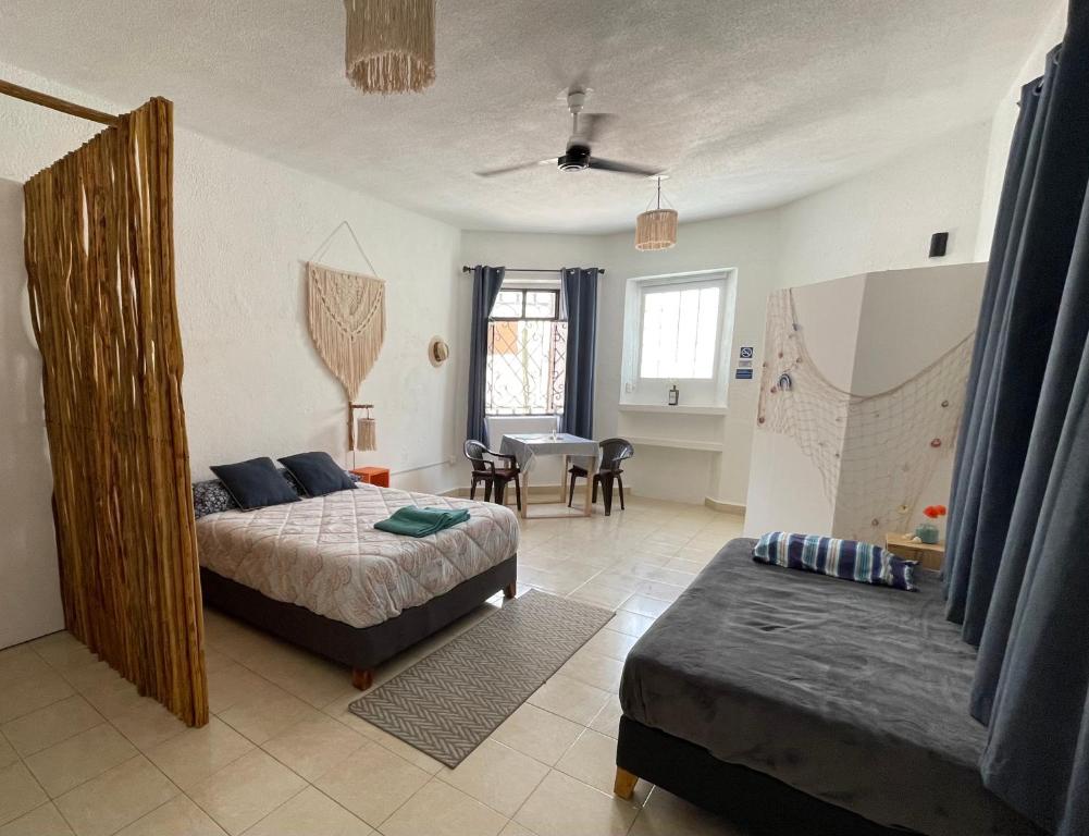 Postel nebo postele na pokoji v ubytování Itzé Hostel Boutique - Progreso
