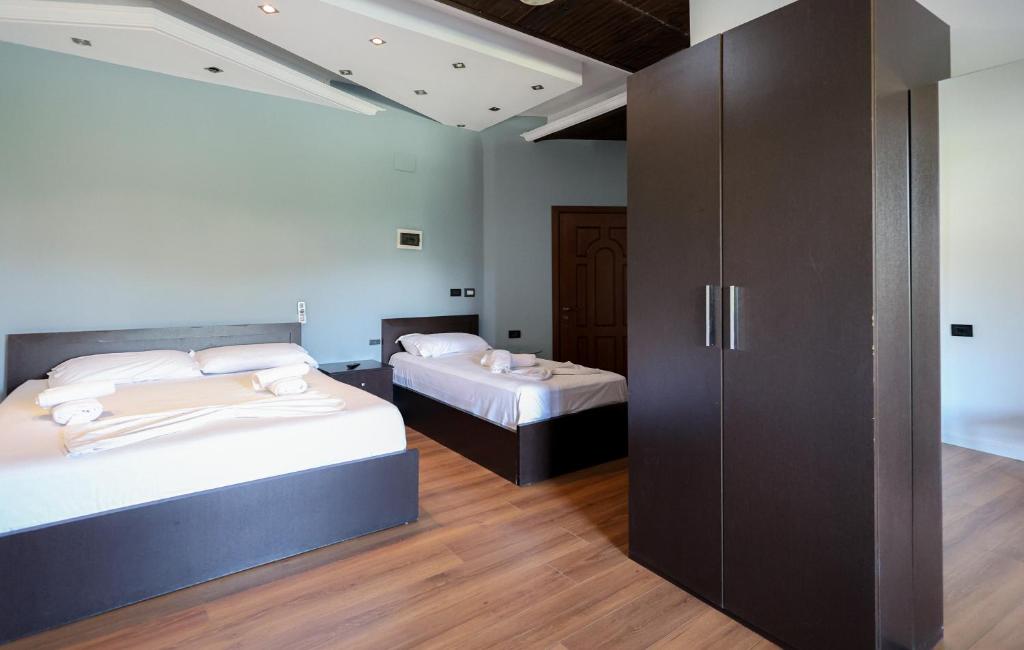 Postel nebo postele na pokoji v ubytování Hotel Ajka