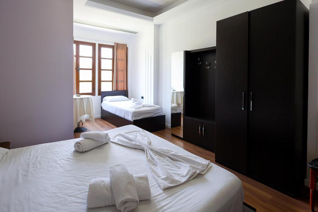 Postel nebo postele na pokoji v ubytování Hotel Ajka