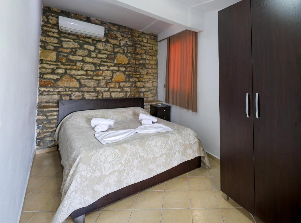 Postel nebo postele na pokoji v ubytování Hotel Ajka