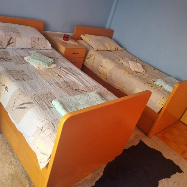 Postel nebo postele na pokoji v ubytování Apartman Mina