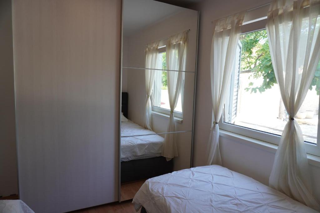 Posteľ alebo postele v izbe v ubytovaní Apartments Maček