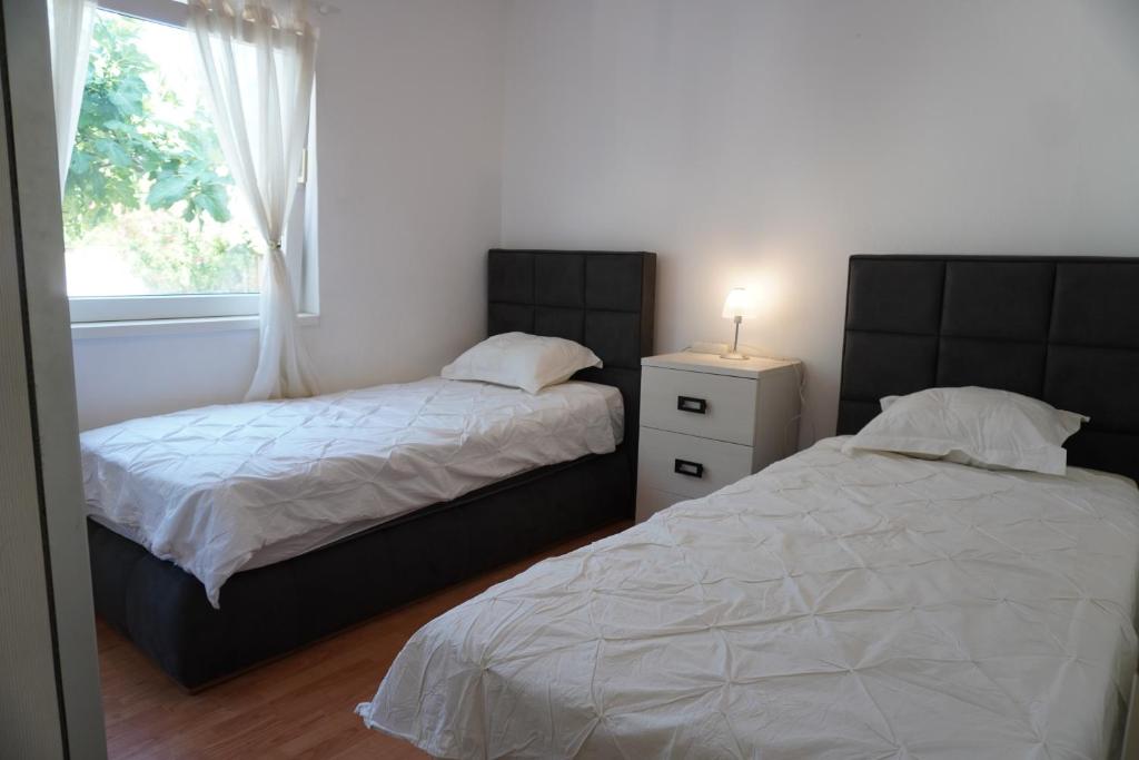 Posteľ alebo postele v izbe v ubytovaní Apartments Maček