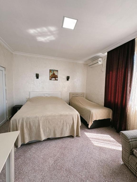 Postel nebo postele na pokoji v ubytování Guest House "Sulo"