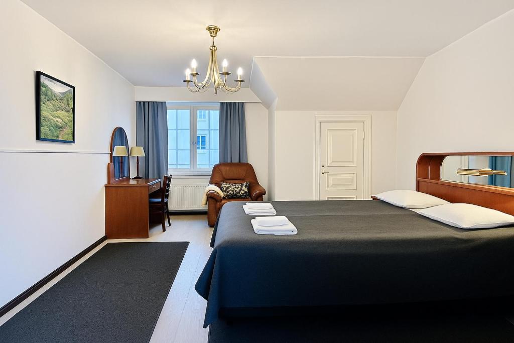 Postel nebo postele na pokoji v ubytování Senate Hotel