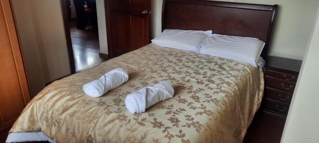 En eller flere senge i et værelse på Departamento en Misicata