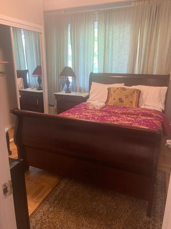 a large bed in a bedroom with a window at Montreal Downtown Private Room in Montreal