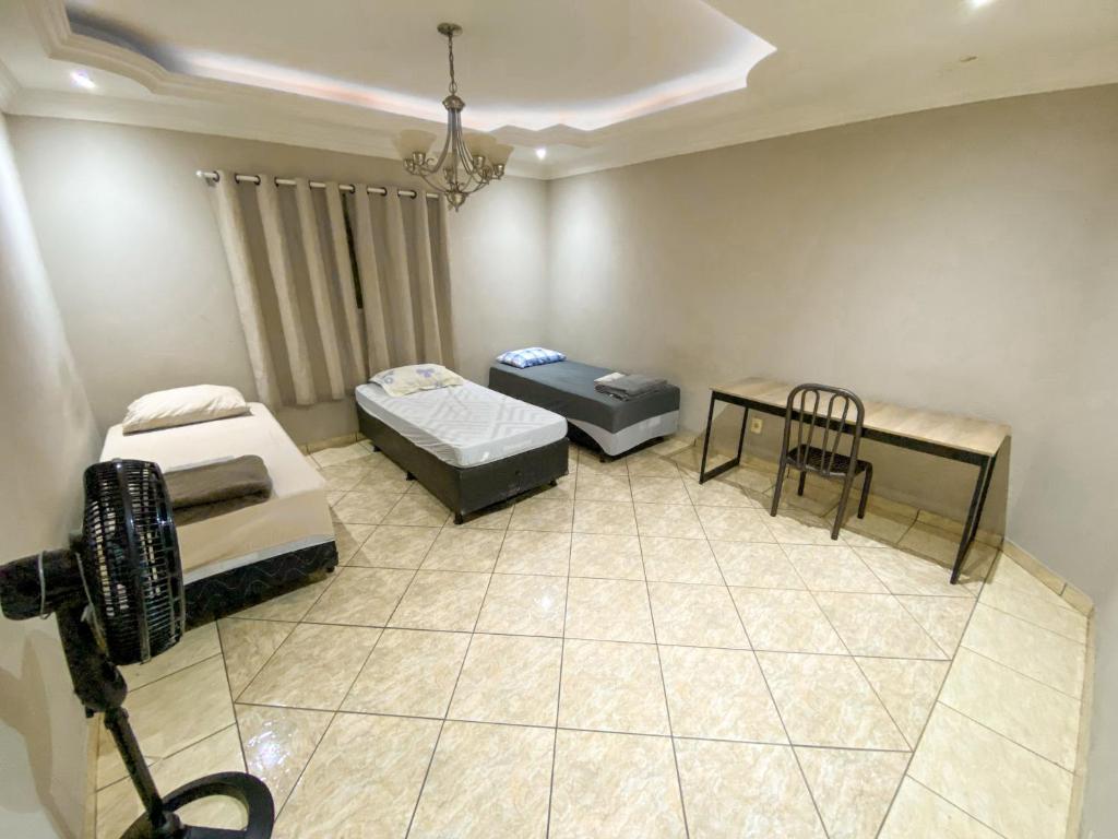 Pousada Acessus - Com Cozinha e Lavanderia - Quarto Triplo Básico Com Banheiro Compartilhado