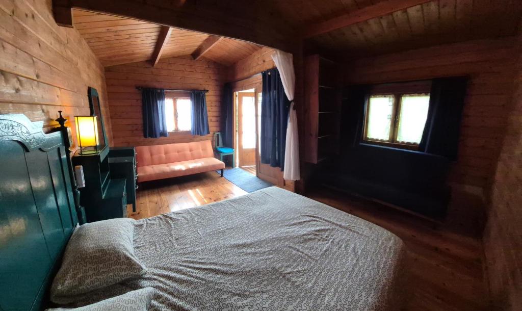 Postel nebo postele na pokoji v ubytování Parque de Campismo Rural Quinta das Laranjeiras