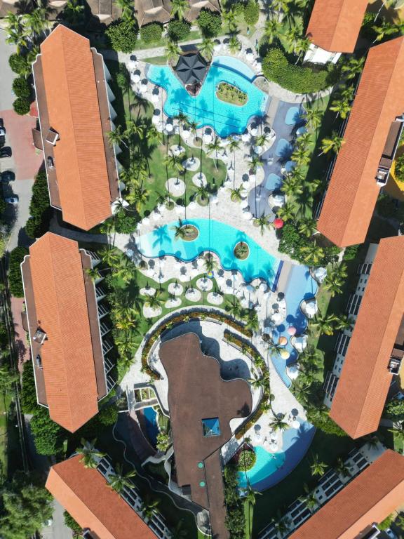 La alberca dentro o cerca de Porto de galinhas flat marulhos resort