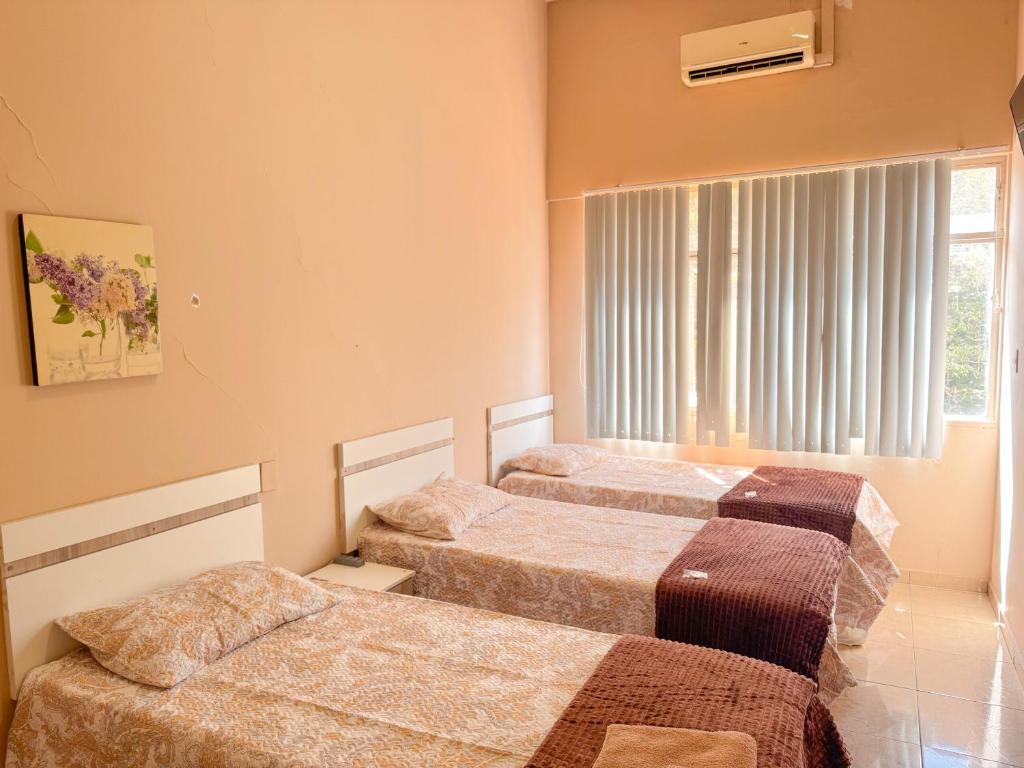Postel nebo postele na pokoji v ubytování Hotel Familiar en Centro de Ciudad del Este