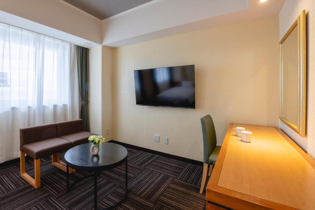 TV a/nebo společenská místnost v ubytování Kanku Izumiotsu Washington Hotel