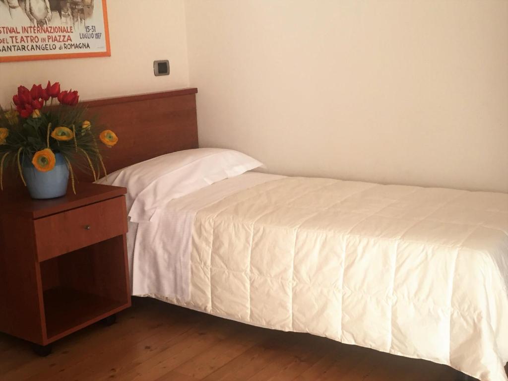 Postel nebo postele na pokoji v ubytování Hotel Rubicone