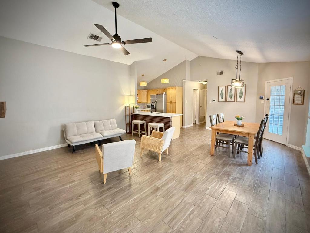 a living room with a couch and a table at Charming 3-bedroom house in delightful Lewisville with AC, WiFi in Lewisville