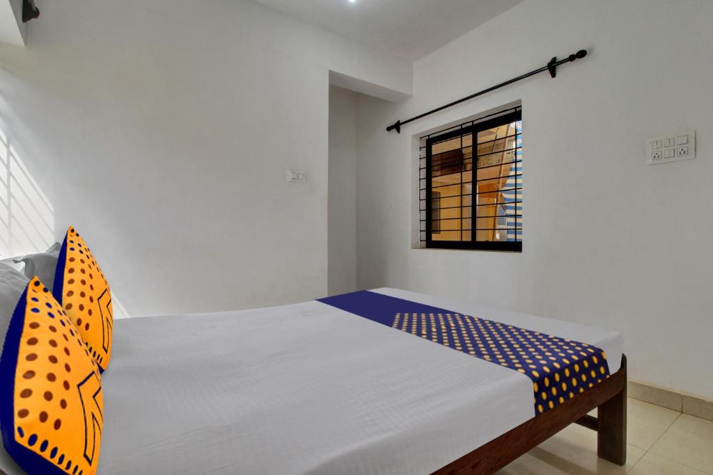 Postel nebo postele na pokoji v ubytování Hotel O U & I LIVINGS