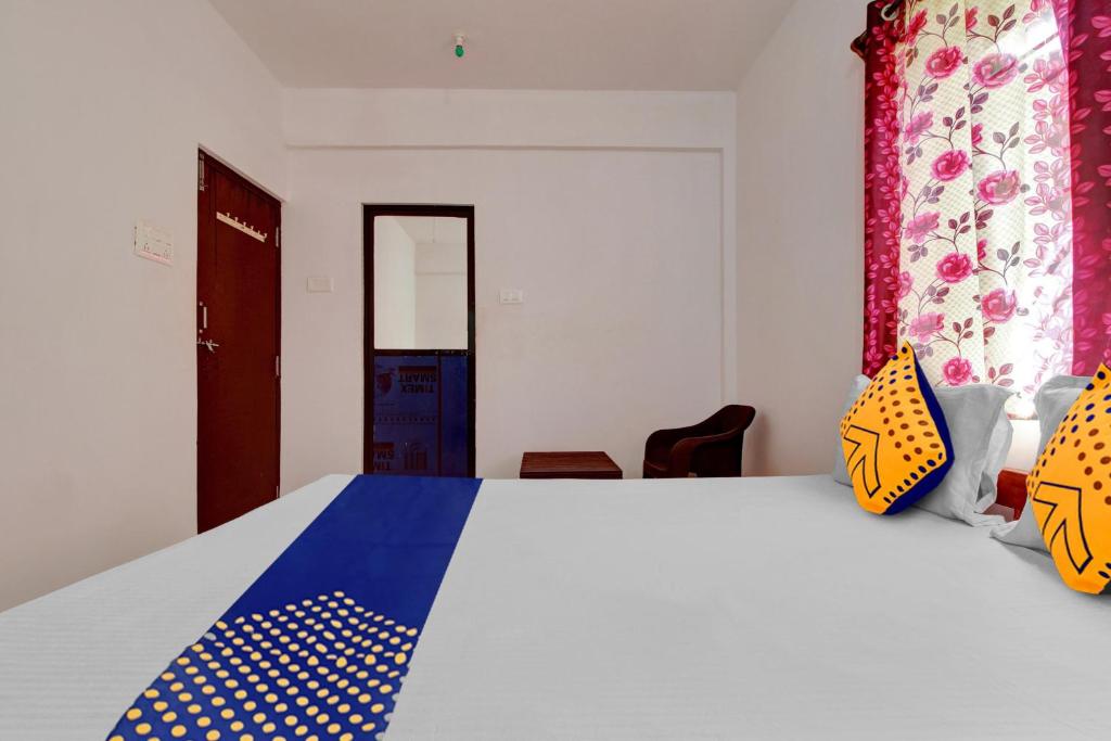 Postel nebo postele na pokoji v ubytování Hotel O U & I LIVINGS