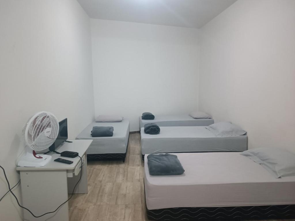 Katil atau katil-katil dalam bilik di Assel Estudios Botanico
