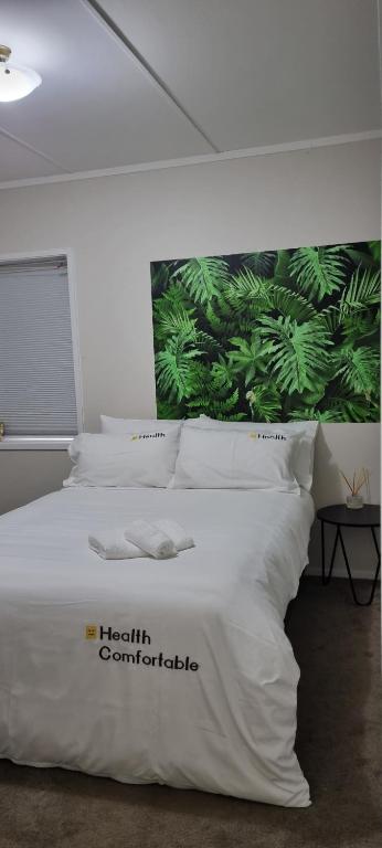 Postel nebo postele na pokoji v ubytování Natural Residence 天然居