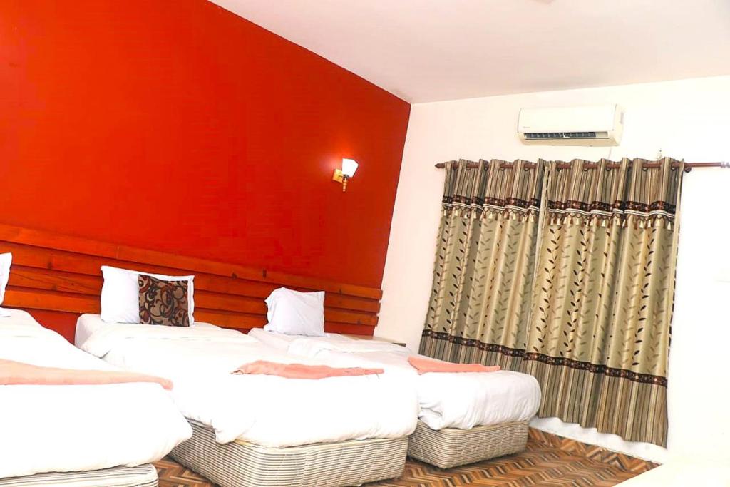 Postel nebo postele na pokoji v ubytování Hotel Surya Adventure