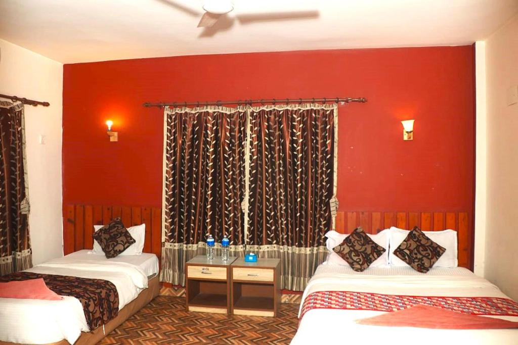 Postel nebo postele na pokoji v ubytování Hotel Surya Adventure