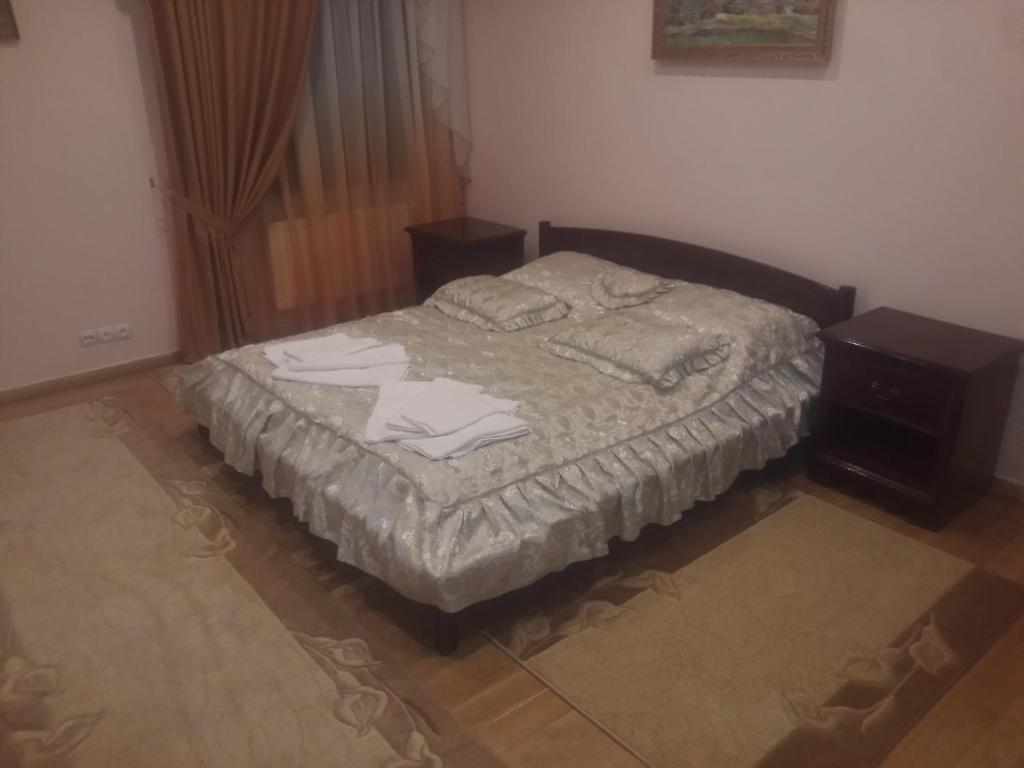 Postel nebo postele na pokoji v ubytování Tourist complex Karina